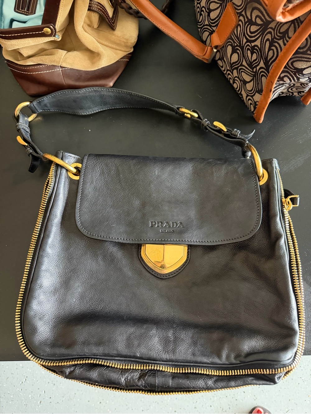 Authentic Prada Black Leather Interior with Gold Logo Plaque